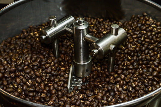 a large pot filled with lots of coffee beans